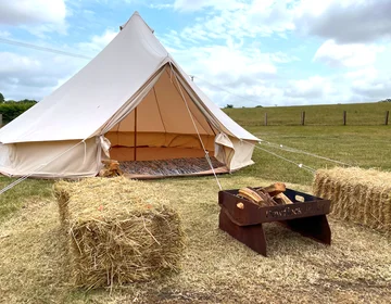 Fire pit and hay bales await you